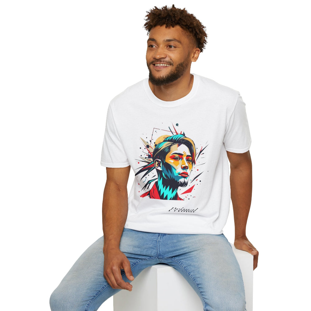 White unisex cotton t-shirt modeled by smiling man with curly hair and beard, featuring bold "Primal" graphic: stylized bearded man portrait with colorful red, yellow, teal, and black paint splatters bursting outward. Elegant black cursive "Primal" text below. Primal masculine energy motivational crewneck tee.