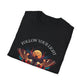 Black folded unisex cotton t-shirt featuring bold "Follow Your Light" graphic: vibrant abstract moth with detailed wings, intense expression, colorful geometric accents, and dynamic paint splatters in red, orange, teal, blue, and gold tones bursting outward around an orange moon background. Arched white text "FOLLOW YOUR LIGHT" above. Motivational spiritual empowerment crewneck tee.
