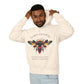 Man wearing a off-white hoodie featuring a vibrant bee graphic with the text "SACRED ALIGNMENT" above and the quote "Even when progress is quiet, the harvest is still forming" below. Casual streetwear style with light jeans.