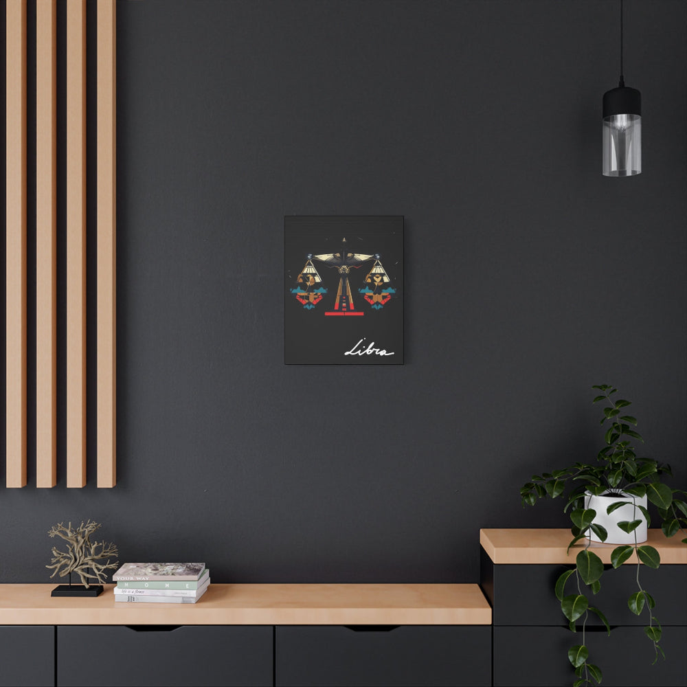 Libra zodiac canvas wall art featuring artistic balance scales illustration on black background, displayed in modern interior above wooden console with plant