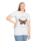 White plus-size unisex cotton t-shirt modeled by smiling woman with long blonde hair, hand on hip, featuring bold "Transformation" graphic: vibrant abstract butterfly with detailed wings, intense expression, colorful geometric accents, and dynamic paint splatters in red, orange, teal, blue, and gold around an orange moon. Arched white text "TRANSFORMATION" above and smaller quote "Even when progress feels fragile, you are becoming free" below. Motivational spiritual empowerment crewneck tee.