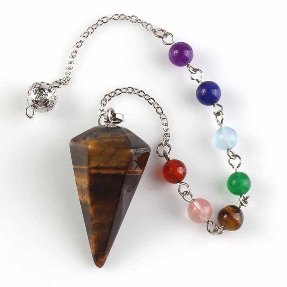 Silver pendulum with a large polished tiger's eye triangular point, attached to a chain with seven chakra gemstone beads (tiger's eye, carnelian, rose quartz, green aventurine, aquamarine, lapis lazuli, amethyst) and an ornate silver acorn charm. Chakra dowsing tool for divination and energy healing.