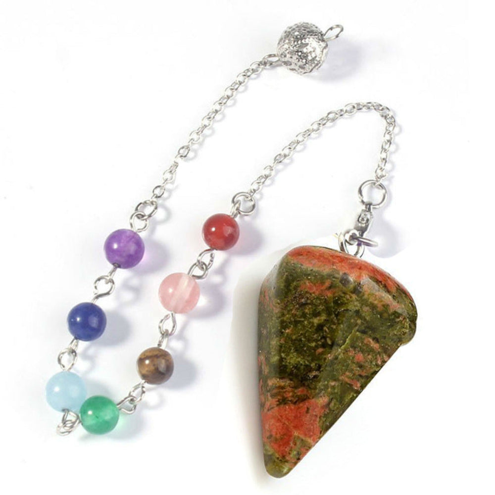 Silver pendulum with a large polished unakite triangular point, attached to a chain with seven chakra gemstone beads (green aventurine, aquamarine, lapis lazuli, amethyst, rose quartz, carnelian, tiger's eye) and an ornate silver acorn charm. Chakra dowsing tool for divination and energy healing.