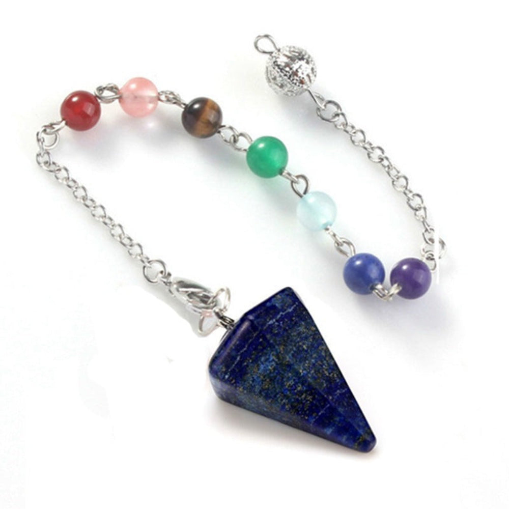Silver pendulum with a large polished lapis lazuli triangular point, attached to a chain with seven chakra gemstone beads (red jasper, rose quartz, tiger's eye, green aventurine, aquamarine, lapis lazuli, amethyst) and an ornate silver acorn charm. Chakra dowsing tool for divination and energy healing.