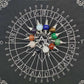 Collection of silver pendulums with various crystal spheres (rose quartz, amethyst, lapis lazuli, opalite, sodalite, tiger's eye, malachite, green aventurine, carnelian, and more) arranged in a circle on a black spirit board chart with letters, numbers, and a central Star of David. Divination and dowsing tools.