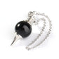 Silver pendulum with a glossy black onyx sphere, pointed metal tip, and ornate silver chain. Classic dowsing tool for divination, energy healing, and spiritual guidance.