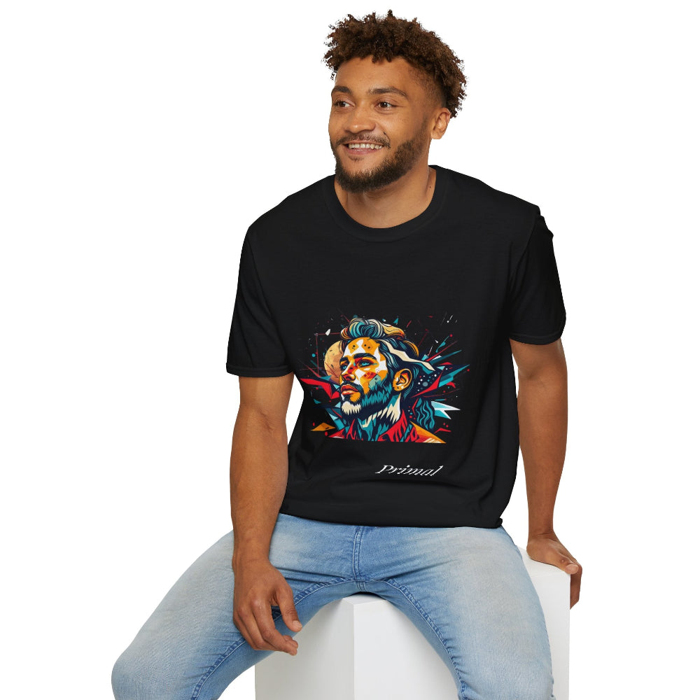 Black unisex cotton t-shirt modeled by smiling man with curly hair and beard, featuring bold "Primal" graphic: stylized bearded man portrait with short curly hair, intense upward gaze, and vibrant multicolored geometric shards in red, yellow, teal, and blue exploding outward. Elegant white cursive "Primal" text below. Primal masculine energy motivational crewneck tee.