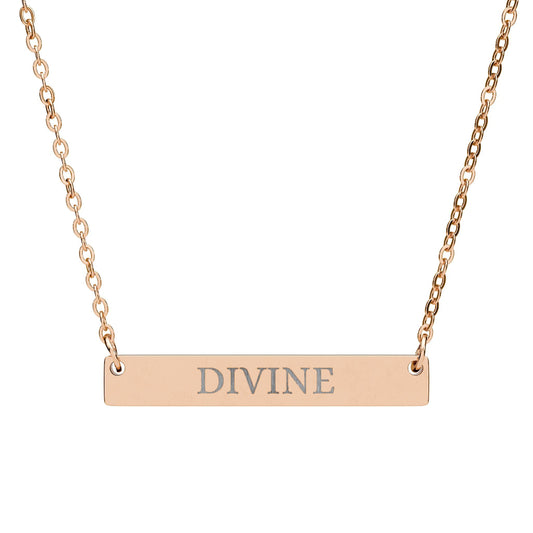 Rose gold bar necklace with engraved uppercase text "DIVINE" on a sleek matte pendant, suspended on a delicate matching rose gold chain. Minimalist spiritual affirmation jewelry for empowerment and divine connection.