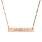 Rose gold bar necklace with engraved uppercase text "ALIGNED" on a sleek matte pendant, suspended on a delicate matching rose gold chain. Minimalist motivational affirmation jewelry for alignment, balance, and spiritual harmony.