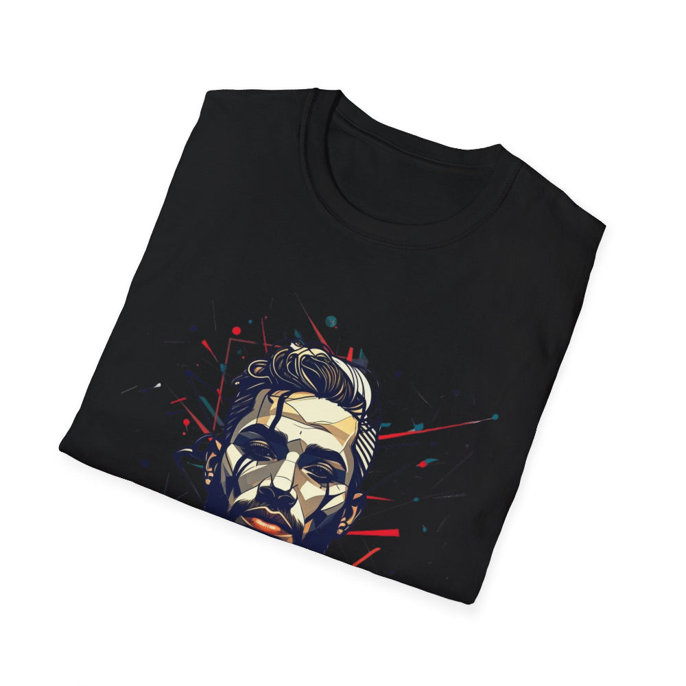 Black folded unisex cotton t-shirt featuring bold Primal graphic print: stylized bearded man portrait with styled hair, intense downward gaze, and vibrant red, teal, blue abstract paint splatters and lines bursting outward. Primal masculine energy motivational crewneck tee.