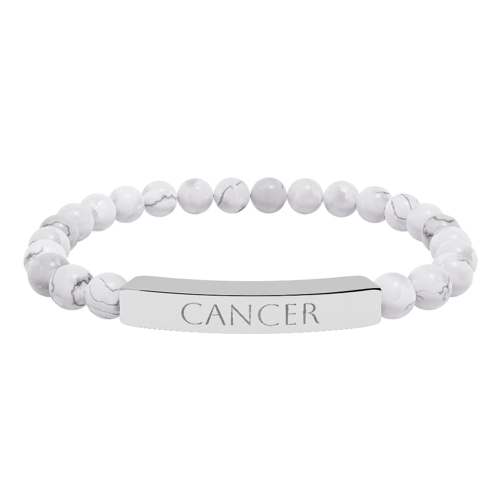 Bracelet with polished white howlite beads featuring natural gray-black veining and marbling, paired with a silver curved bar engraved "CANCER" in uppercase letters. Stretch-fit zodiac-inspired crystal jewelry.