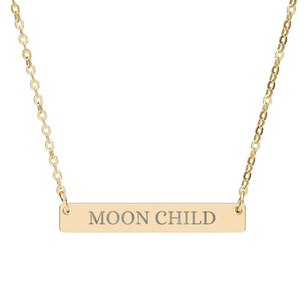Gold bar necklace featuring engraved uppercase text "MOON CHILD" on a sleek matte pendant, suspended on a delicate matching gold chain. Minimalist spiritual affirmation jewelry for lunar energy, intuition, and cosmic connection.