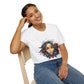 White unisex cotton t-shirt modeled by smiling woman with braided hair, hand on cheek, featuring bold "Feral" graphic on chest: vibrant abstract portrait of a fierce woman with wild flowing hair, intense expression, tribal markings, colorful geometric accents, and dynamic paint splatters in red, orange, teal, blue, and gold tones bursting outward around an orange moon background. White elegant cursive "Feral" text below. Wild feminine energy motivational crewneck tee.