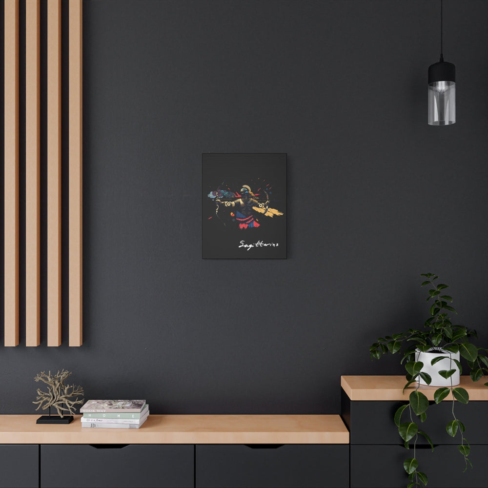 Black canvas wall art print of abstract Sagittarius archer with bow, dynamic pose, flowing cape, and colorful splatters on dark background, featuring "Sagittarius" in elegant white cursive  hung on a dark grey wall above a wooden shelf with potted plants.
