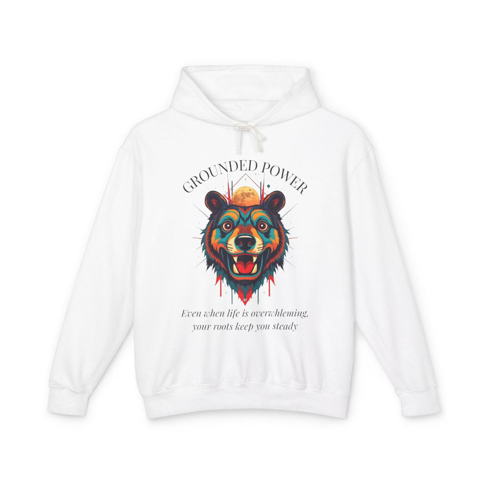 White hoodie with vibrant multicolored bear head graphic, roaring expression, mane in blue orange teal splashes, full moon above, "GROUNDED POWER" arched text, motivational quote "Even when life is overwhelming, your roots keep you steady" below