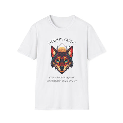 White unisex cotton t-shirt featuring bold "Shadow Guide" graphic: vibrant abstract wolf head portrait with intense blue-green eyes, colorful geometric accents, and dynamic paint splatters in red, orange, teal, blue, and gold tones bursting outward around an orange moon background. Arched white text "SHADOW GUIDE" above and smaller inspirational quote "Even when fear appears, your intuition shows the way" below. Motivational spiritual empowerment crewneck tee.
