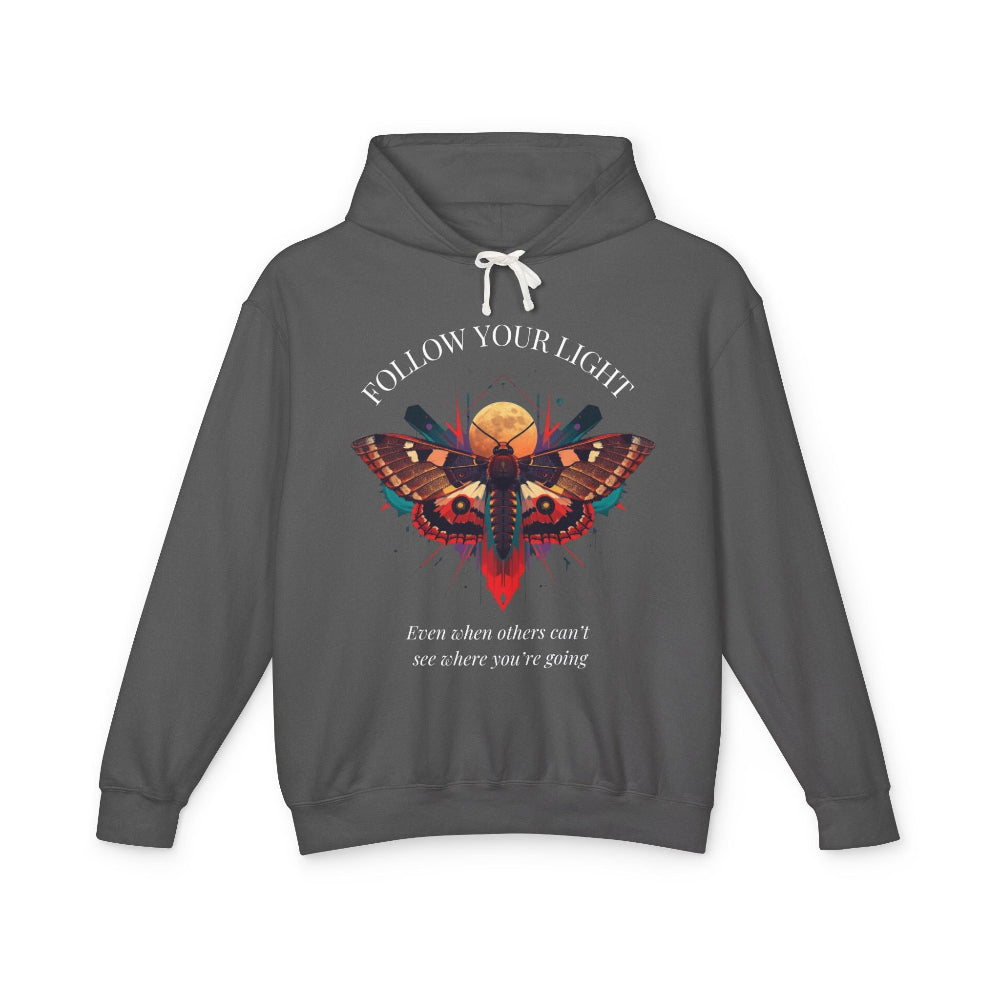 Dark gray hoodie with vibrant multicolored moth/butterfly graphic, geometric sun/moon elements, "FOLLOW YOUR LIGHT" arched text above, motivational quote "Even when others can't see where you're going" below