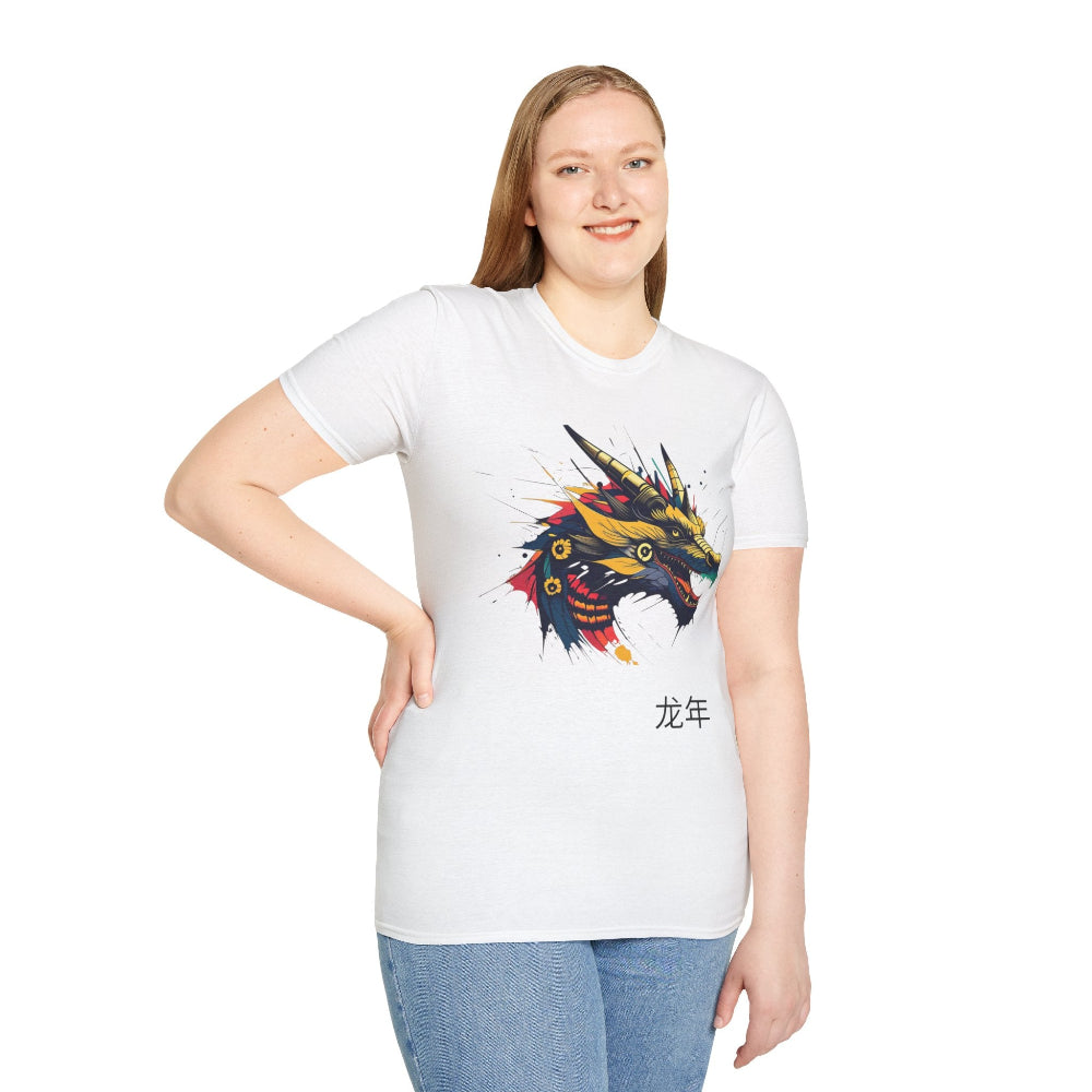 White unisex cotton t-shirt modeled by smiling plus-size female with long blonde hair, hand on hip, featuring bold Year of the Dragon graphic: vibrant abstract dragon head portrait with fierce open mouth, sharp golden horns, intricate scales, flowing mane, and dynamic multicolored paint splatters in gold, red, black, blue, teal, and orange tones exploding outward. Chinese text "龙年" (Year of the Dragon) printed below in black. Zodiac Chinese New Year motivational crewneck tee.
