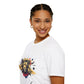 White unisex cotton t-shirt in side profile on smiling woman with braided hair, featuring bold Leo zodiac graphic on chest: vibrant abstract lion head portrait with powerful mane, fierce intense eyes, regal expression, geometric accents, and dynamic multicolored paint splatters in gold, red, navy, teal, and black tones exploding outward. Elegant black cursive "Leo" text below. Astrology zodiac motivational crewneck tee.
