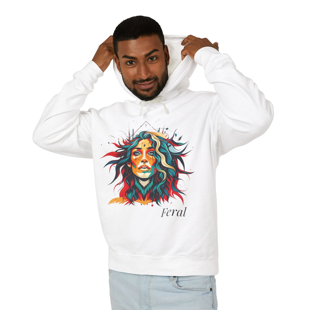 Young man with short hair pulling up the hood of a white hoodie featuring vibrant artistic portrait of a fierce woman with curly multicolored flowing hair, teal red blue orange face accents, large hoop earrings, third-eye symbol, "Feral" text below