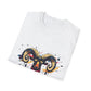 White folded unisex cotton t-shirt featuring bold Aries zodiac graphic print: vibrant abstract ram head portrait with large curved horns, intense expression, geometric patterns, and dynamic multicolored paint splatters in gold, red, navy, teal, and black tones exploding outward. Elegant black cursive "Aries" text below. Astrology zodiac motivational crewneck tee.