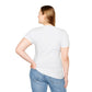White plus-size unisex cotton t-shirt back view on smiling woman with long blonde hair, hands on hips: plain blank white with no print, short sleeves, fitted style, curved hem, and natural drape. Soft comfortable premium basic white t-shirt rear view.