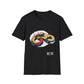Black unisex cotton t-shirt featuring bold Year of the Snake graphic: vibrant abstract coiled snake in infinity/figure-8 shape with fierce expression, detailed scales, hypnotic eyes, and dynamic multicolored paint splatters in gold, red, black, green, teal, and orange tones exploding outward. Chinese text "蛇年" (Year of the Snake) printed below in white. Zodiac Chinese New Year motivational crewneck tee.