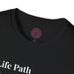 Black unisex cotton t-shirt neckline close-up detail: soft ribbed crewneck collar with clean stitching, comfortable fit, inner tag featuring a purple and gold circular zodiac wheel logo with 12 astrological signs arranged around the rim and central glowing star compass design. 100% cotton premium quality label visible. Essential motivational tee collar detail.
