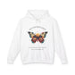 White hoodie featuring colorful abstract butterfly graphic with moon background, "TRANSFORMATION" arched above, and inspirational quote "Even when process feels fragile, you are becoming free" below
