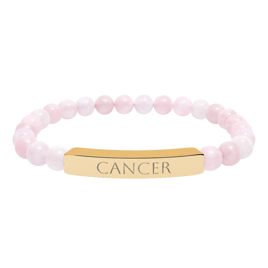 Bracelet with polished rose quartz beads in soft pink tones, natural translucent glow, paired with a gold-plated curved bar engraved "CANCER" in uppercase letters. Stretch-fit zodiac-inspired crystal jewelry.