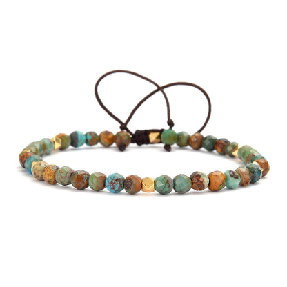 Turquoise and mixed stone wrap bracelet: faceted round beads in earthy turquoise, brown, orange, and green tones with natural veining, accented by gold spacers and adjustable brown cord tie closure. Boho handmade crystal jewelry for grounding and protection.