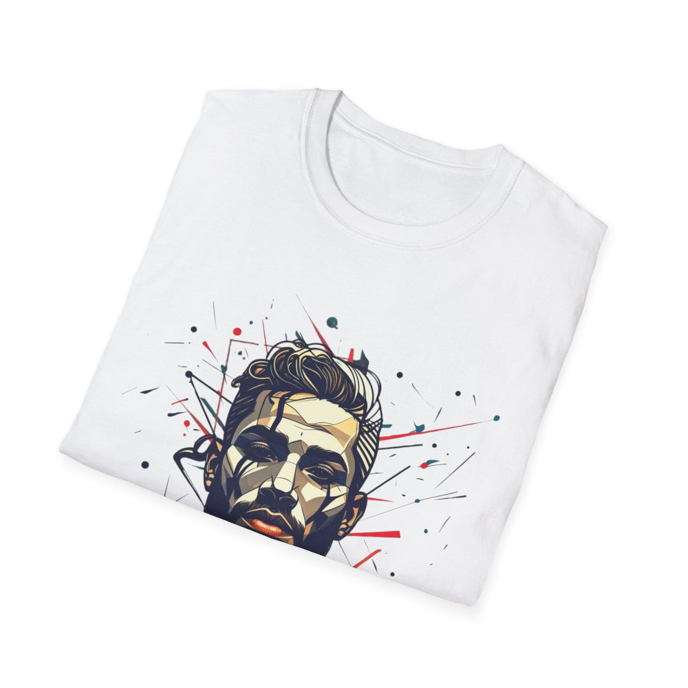 White folded unisex cotton t-shirt featuring bold Primal graphic print: stylized bearded man portrait with stylish hair, intense expression, and vibrant red, teal, black abstract paint splatters and lines bursting outward. Primal masculine energy motivational crewneck tee.