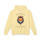 Light yellow hoodie with vibrant colorful lion head graphic, mane in orange teal blue splashes, "BOLD PRESENCE" arched text above, motivational quote "Even when challenges arise, your heart leads with confidence" below