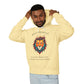Young man with short hair pulling up the hood of a yellow hoodie featuring vibrant artistic print of a fierce woman with long flowing hair, red-orange armored top, colorful paint splash design, "Feral" text below