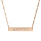 Rose gold bar necklace with engraved uppercase text "MAGNETIC" on a sleek matte pendant, suspended on a delicate matching rose gold chain. Minimalist motivational affirmation jewelry for attraction, charisma, and positive energy.