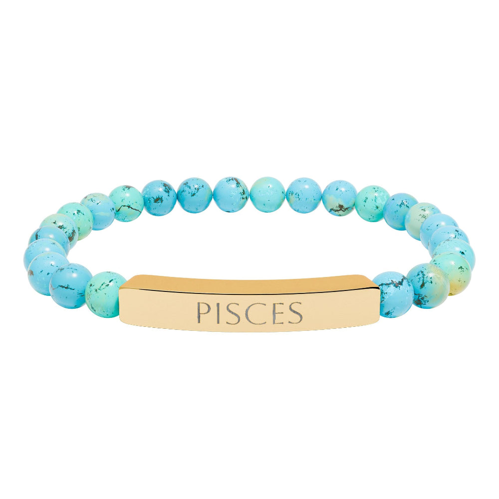 Bracelet with polished turquoise beads in soft aqua-blue tones with natural veining and speckles, featuring a gold-plated curved bar engraved "PISCES" in uppercase letters. Stretch-fit zodiac-inspired crystal jewelry.