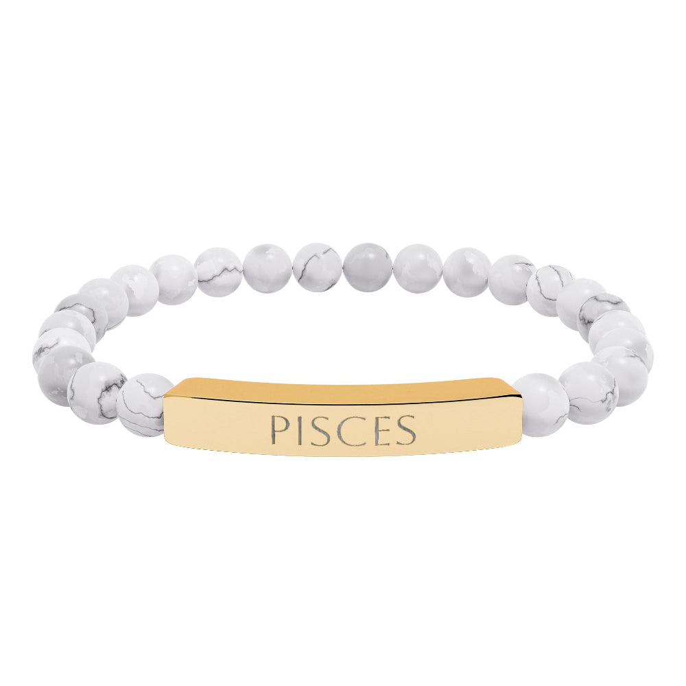 Bracelet with polished white howlite beads featuring natural gray-black veining and marbling, paired with a gold-plated curved bar engraved "PISCES" in uppercase letters. Stretch-fit zodiac-inspired crystal jewelry.