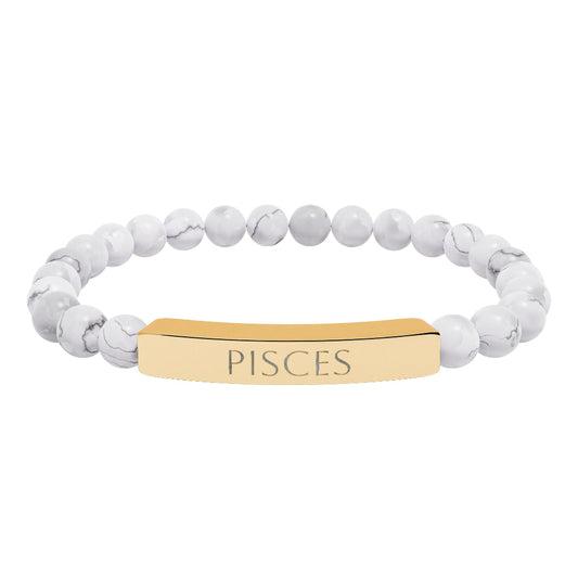 Bracelet with polished white howlite beads featuring natural gray-black veining and marbling, paired with a gold-plated curved bar engraved "PISCES" in uppercase letters. Stretch-fit zodiac-inspired crystal jewelry.