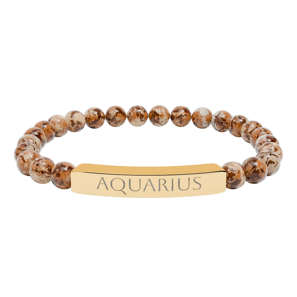 Bracelet with polished leopard jasper beads in earthy brown tones with natural veining, featuring a gold-plated curved bar engraved "AQUARIUS" in uppercase letters. Stretch-fit zodiac-inspired crystal jewelry.
