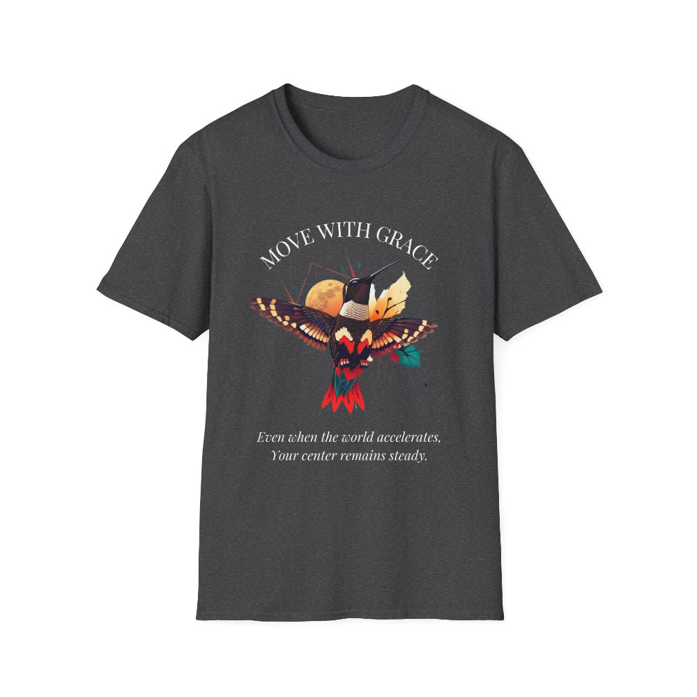 Dark gray t-shirt featuring a vibrant hummingbird graphic with the text "MOVE WITH GRACE" arched above and the quote "Even when the world accelerates, Your center remains steady" below. Motivational spiritual apparel.