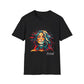 Black unisex cotton t-shirt featuring bold "Feral" graphic: vibrant abstract portrait of a fierce woman with wild flowing multicolored hair, intense expression, tribal markings and forehead jewel, colorful geometric accents, and dynamic paint splatters in red, orange, teal, blue, and gold tones bursting outward. White elegant cursive "Feral" text below. Wild feminine energy motivational crewneck tee.