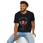 Black unisex cotton t-shirt modeled by smiling man with curly hair and beard, featuring bold "Trust Your Vision" graphic: vibrant abstract phoenix/eagle with spread wings, intense expression, colorful geometric accents, and dynamic paint splatters in red, orange, teal, blue, and gold tones around an orange moon. Arched white text "TRUST YOUR VISION" above and smaller quote "Even when others can't see where you're going, see with your own eyes" below. Motivational spiritual empowerment crewneck tee.