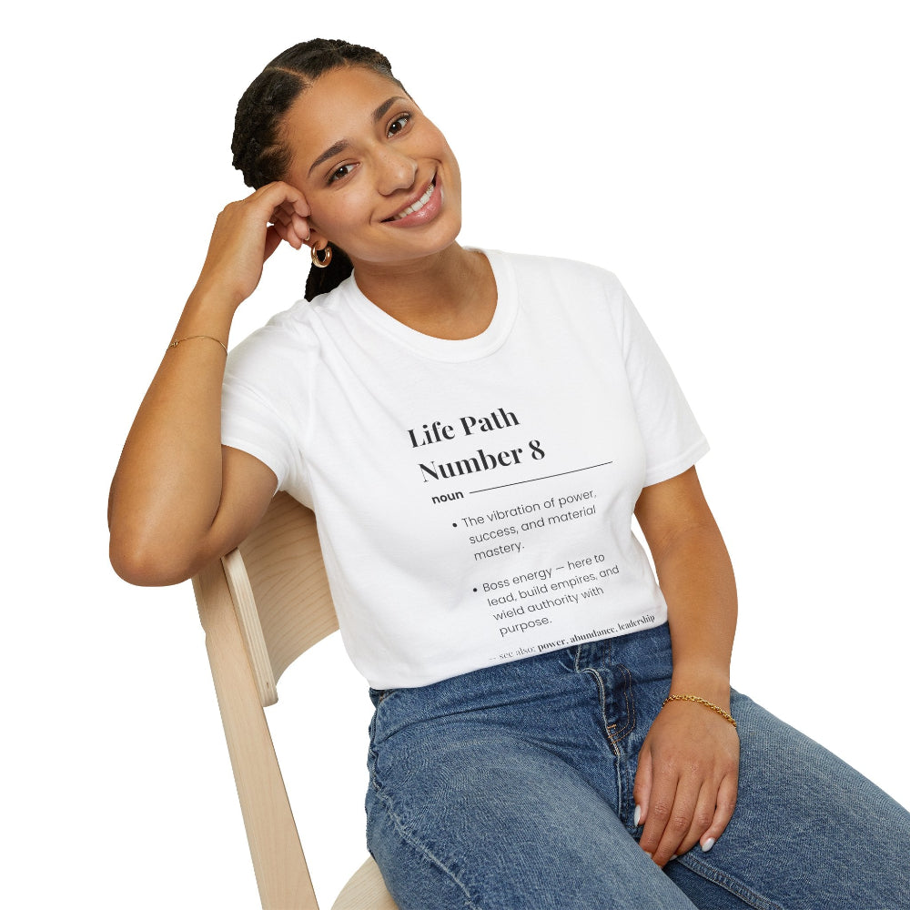 White unisex cotton t-shirt modeled by smiling woman with braided hair, featuring bold Life Path Number 8 numerology print: dictionary-style definition of power, success, material mastery, boss energy, building empires, authority, abundance & leadership. Motivational spiritual self-discovery crewneck tee.