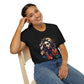 Black unisex cotton t-shirt modeled by smiling woman with braided hair, hand on cheek, featuring bold "Feral" graphic on chest: vibrant abstract portrait of a fierce woman with wild flowing hair, intense expression, tribal markings, colorful geometric accents, and dynamic paint splatters in red, orange, teal, blue, and gold tones bursting outward around an orange moon background. White elegant cursive "Feral" text below. Wild feminine energy motivational crewneck tee.