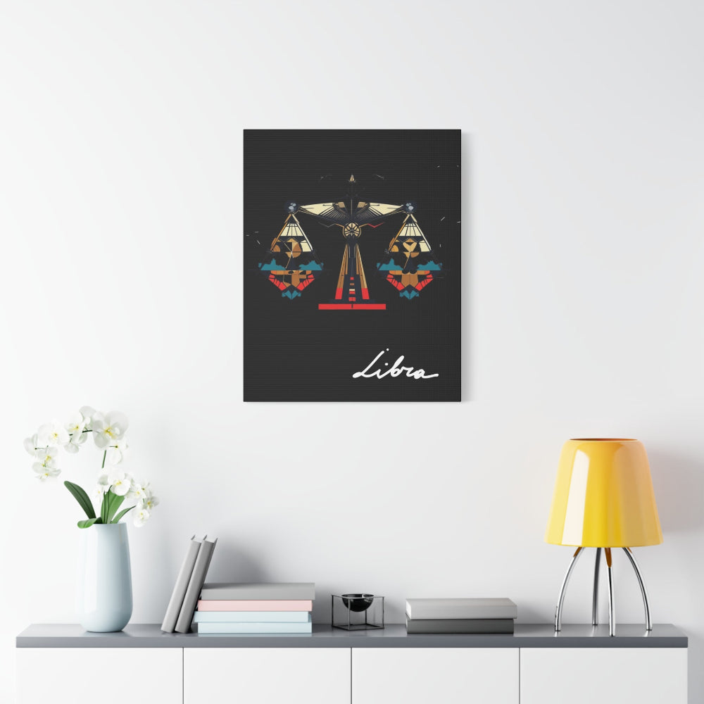 Black canvas wall art print of geometric Libra scales with intricate patterns and colorful accents on dark background, featuring "Libra" in elegant white cursive. Modern zodiac decor piece above a console table with books and lamp.