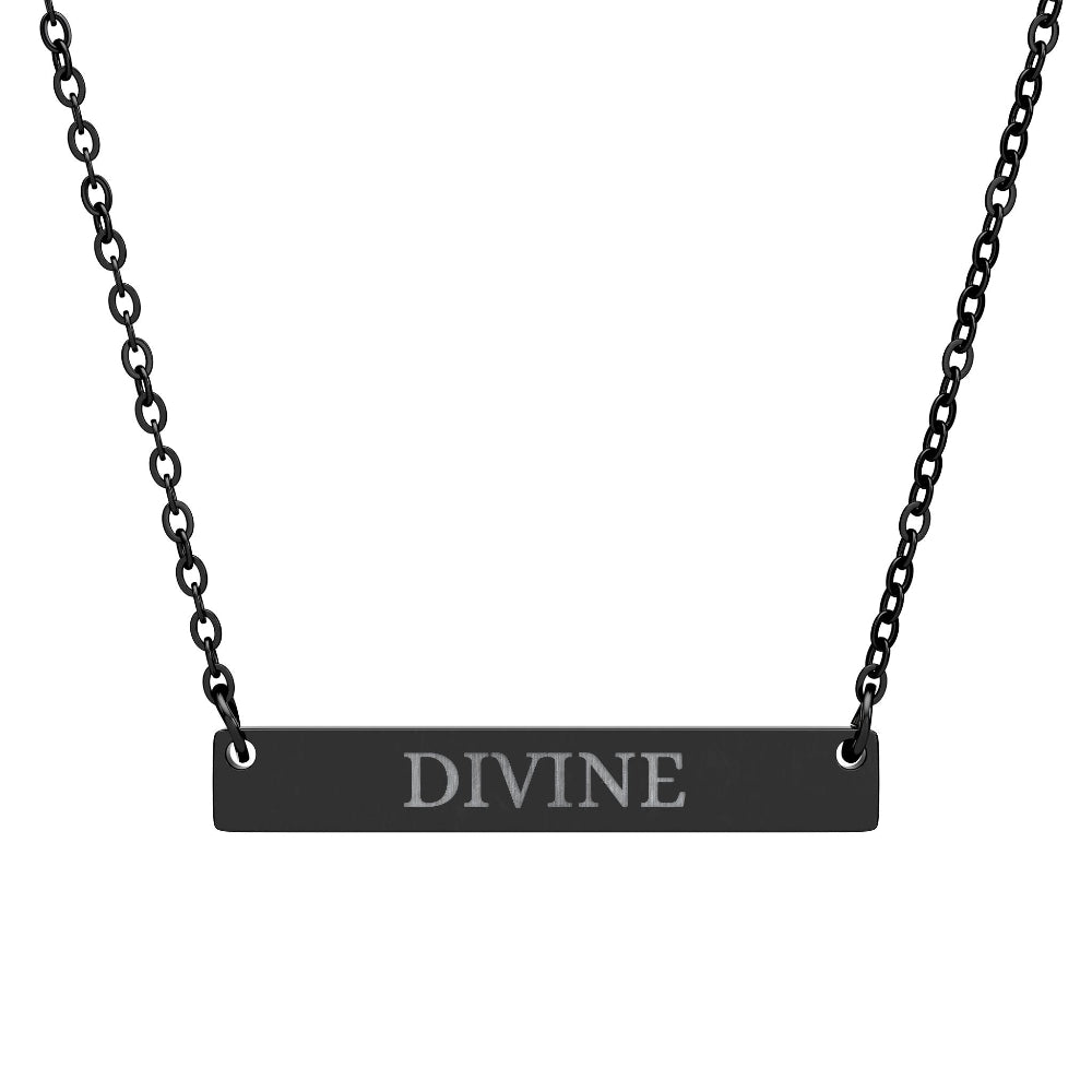 Black bar necklace with engraved uppercase text "DIVINE" on a matte black pendant, suspended on a delicate black chain. Minimalist spiritual affirmation jewelry for empowerment and divine connection.