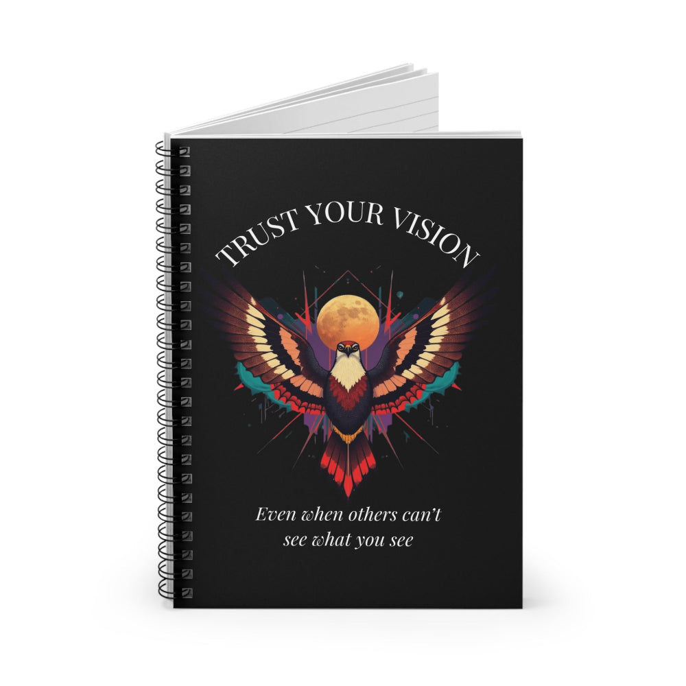 Notebook with a colorful abstract phoenix/eagle with spread wings, intense expression, and paint splatters on a black background, featuring the words "TRUST YOUR VISION" and quote "Even when others can't see what you see".