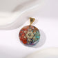 Round orgonite pendant necklace with Metatron's Cube sacred geometry in gold wire, embedded colorful healing crystals (turquoise, carnelian, amethyst) in clear resin, gold engraved triangular bail on white wavy background