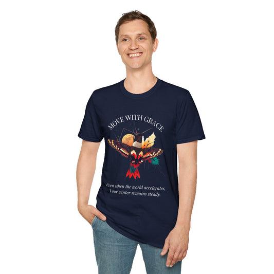 Man wearing a nave blue speckled t-shirt featuring a vibrant hummingbird graphic with the text "MOVE WITH GRACE" above and the quote "Even when the world accelerates, Your center remains steady" below. Casual motivational streetwear style with blue jeans.