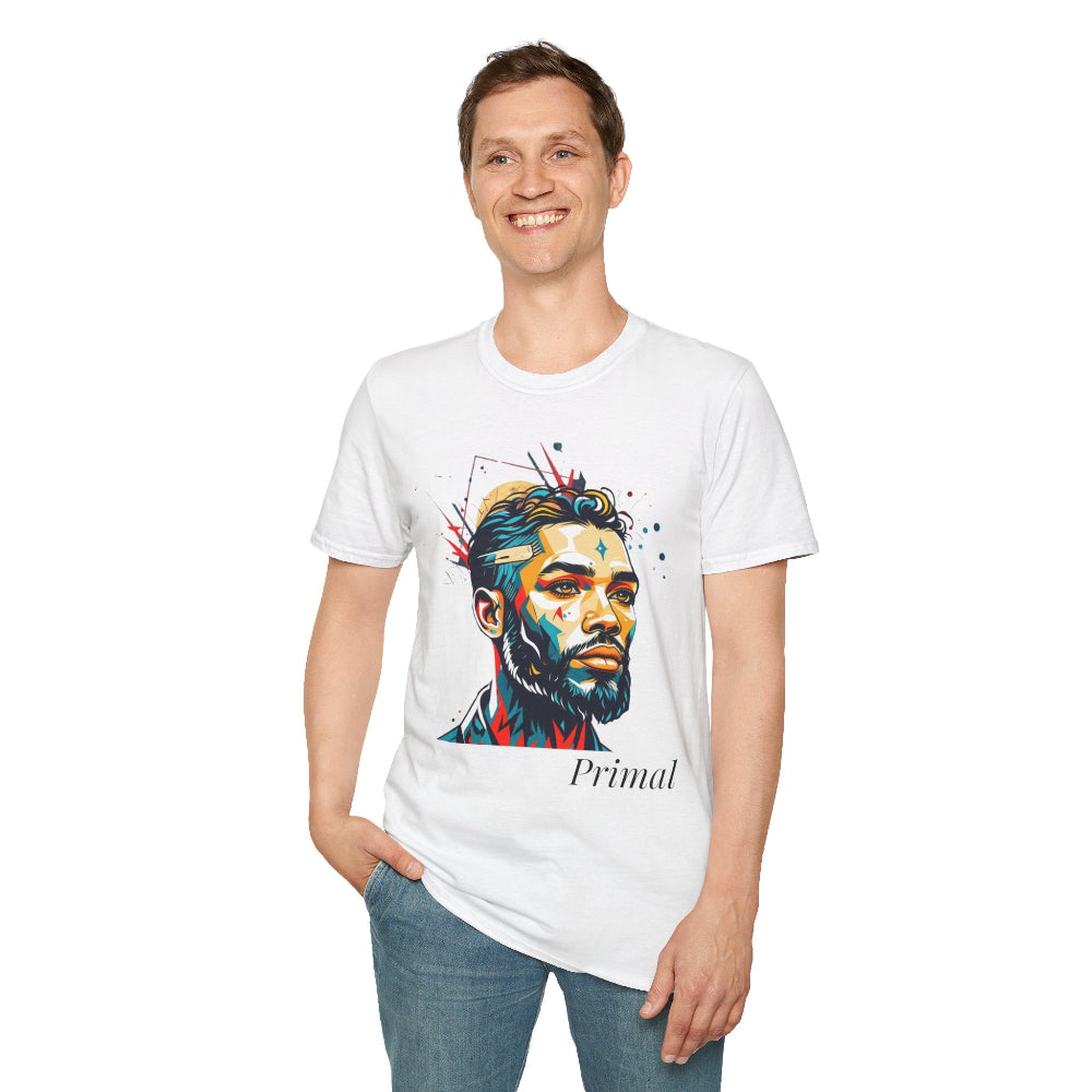 White unisex cotton t-shirt modeled by smiling man with hand in pocket, featuring bold "Primal" graphic: stylized intense bearded man portrait with short styled hair, vibrant multicolored geometric face in red, blue, teal, orange, and yellow tones, dynamic paint splatters bursting outward. Elegant black cursive "Primal" text below. Primal masculine energy motivational crewneck tee.